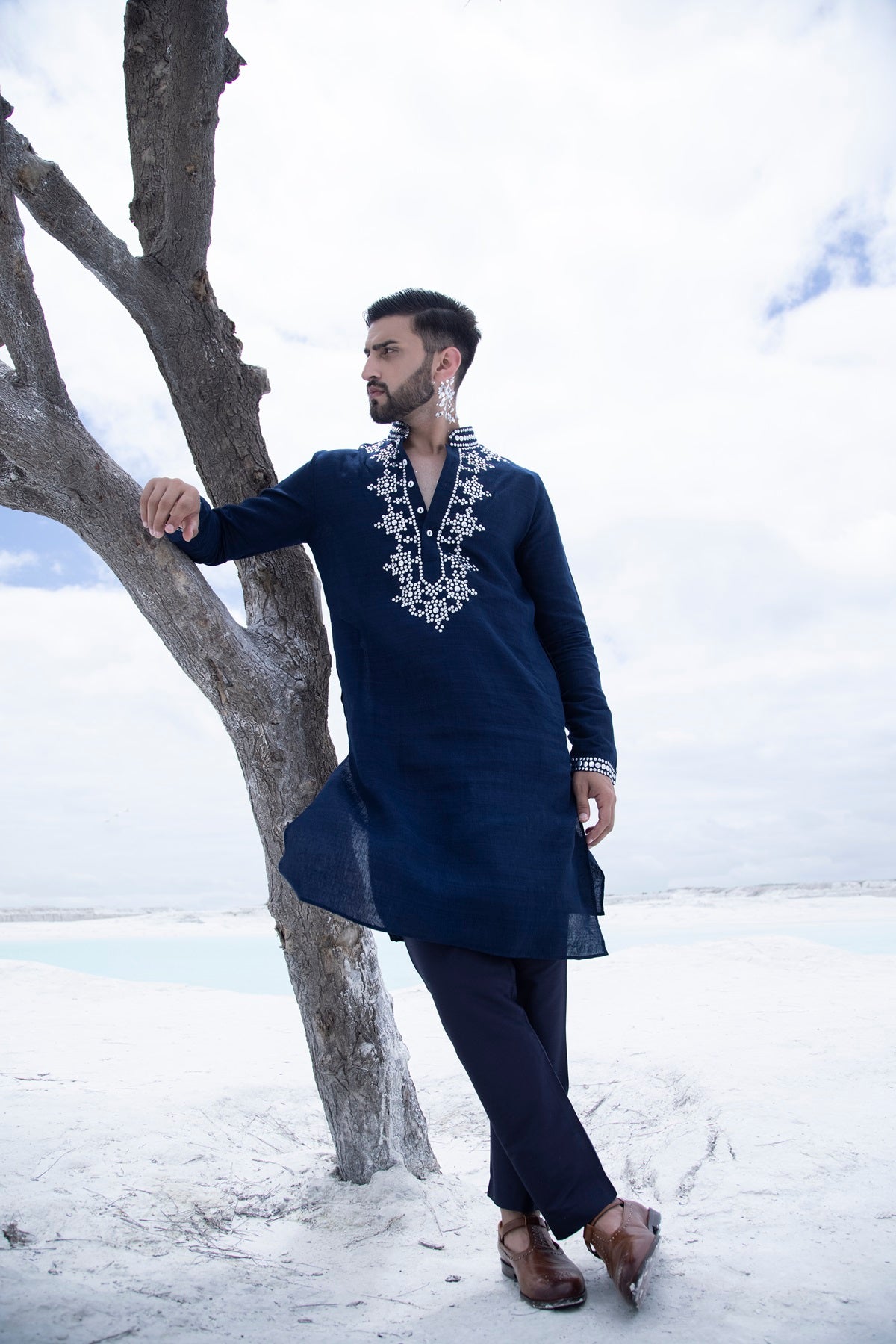 Banarasi silk kurta embellished with metal studs paired with Alighari pyjami