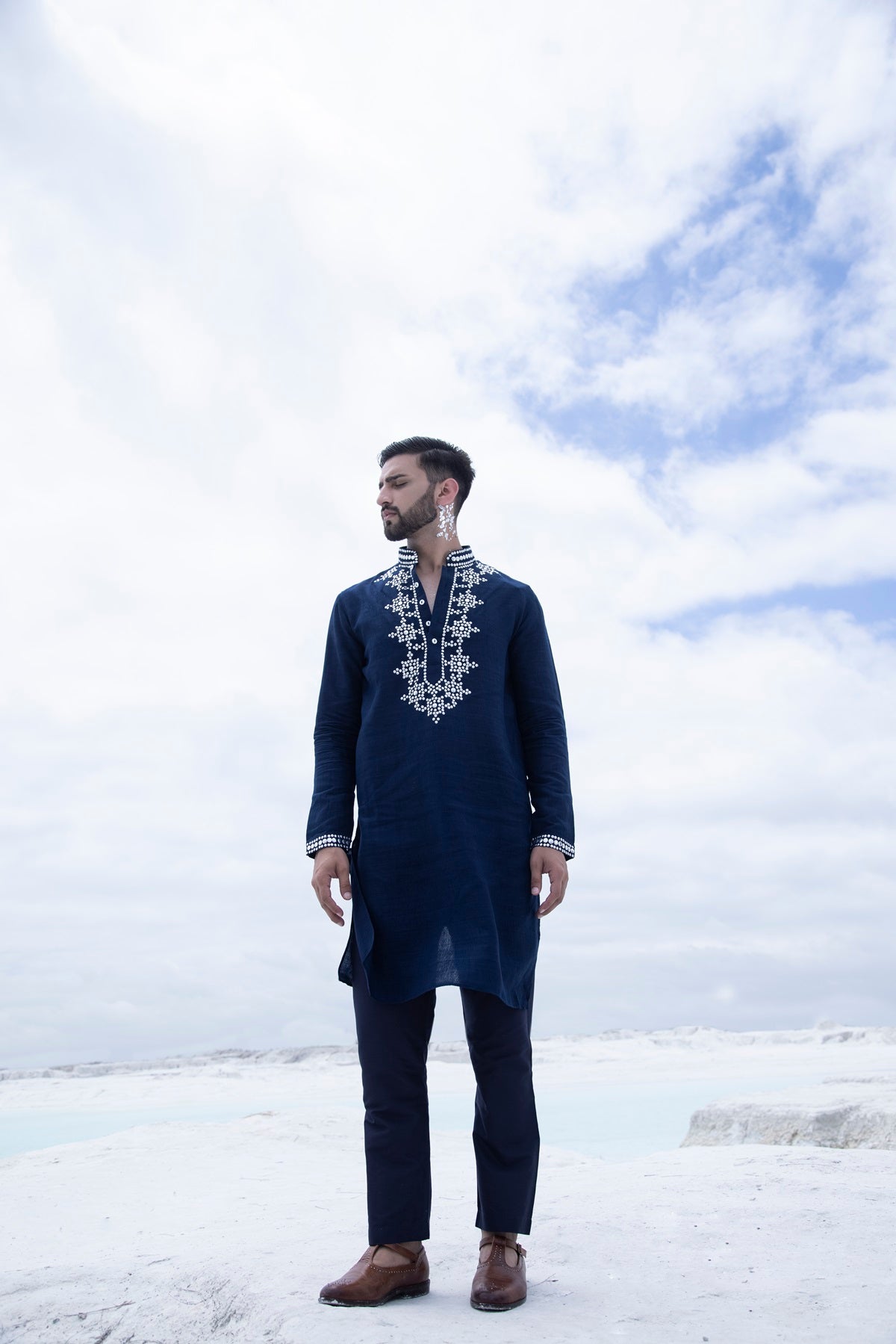 Banarasi silk kurta embellished with metal studs paired with Alighari pyjami