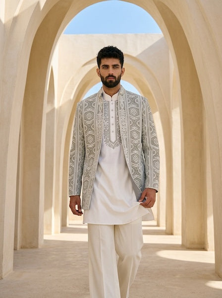 Sage green textured rayon Indo-Western jacket with ivory dori embroidery, paired with an embroidered ivory knit kurta and matching pants.