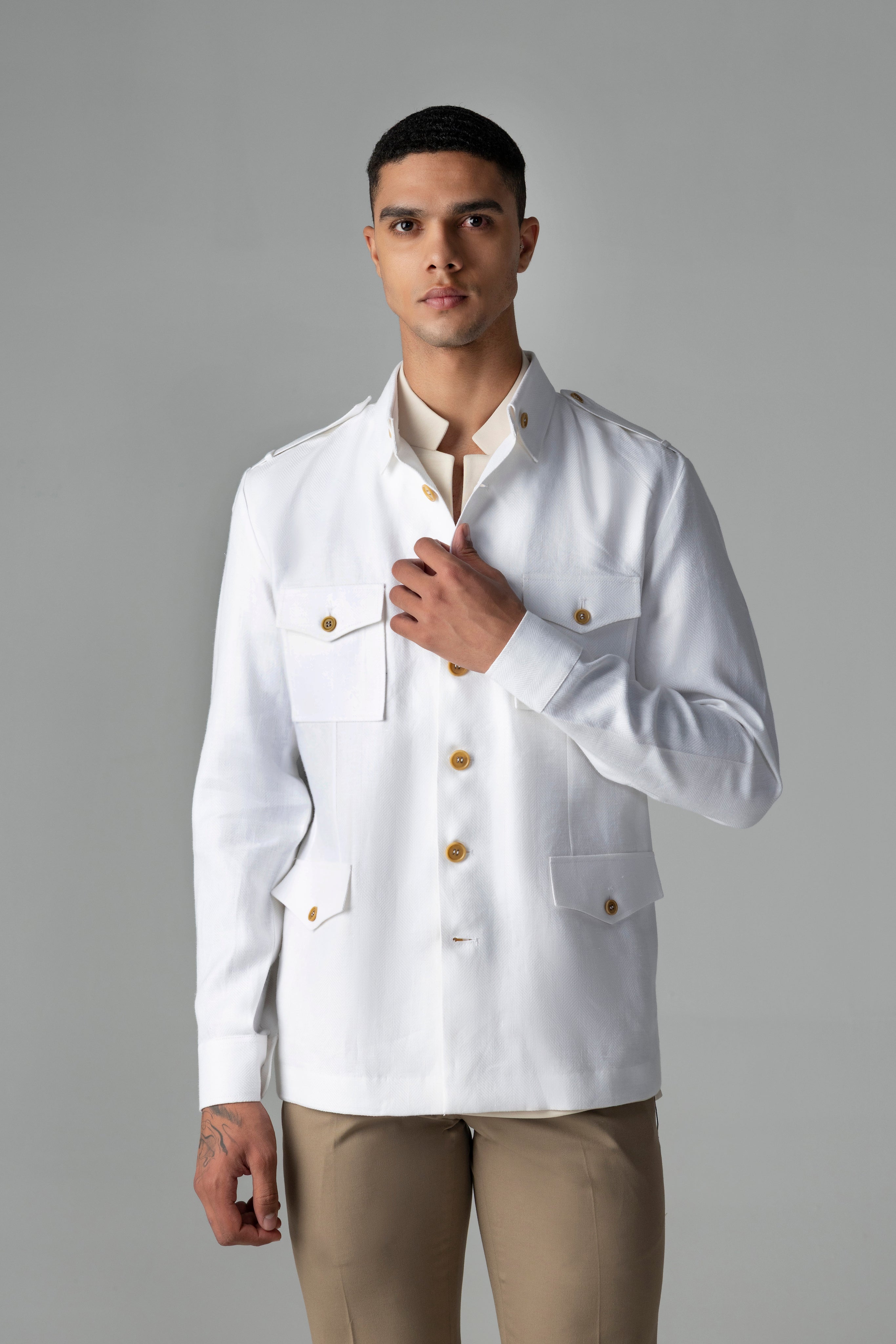 Whiite linen shacket with four patch pockets, button down collar and contrast button detailing