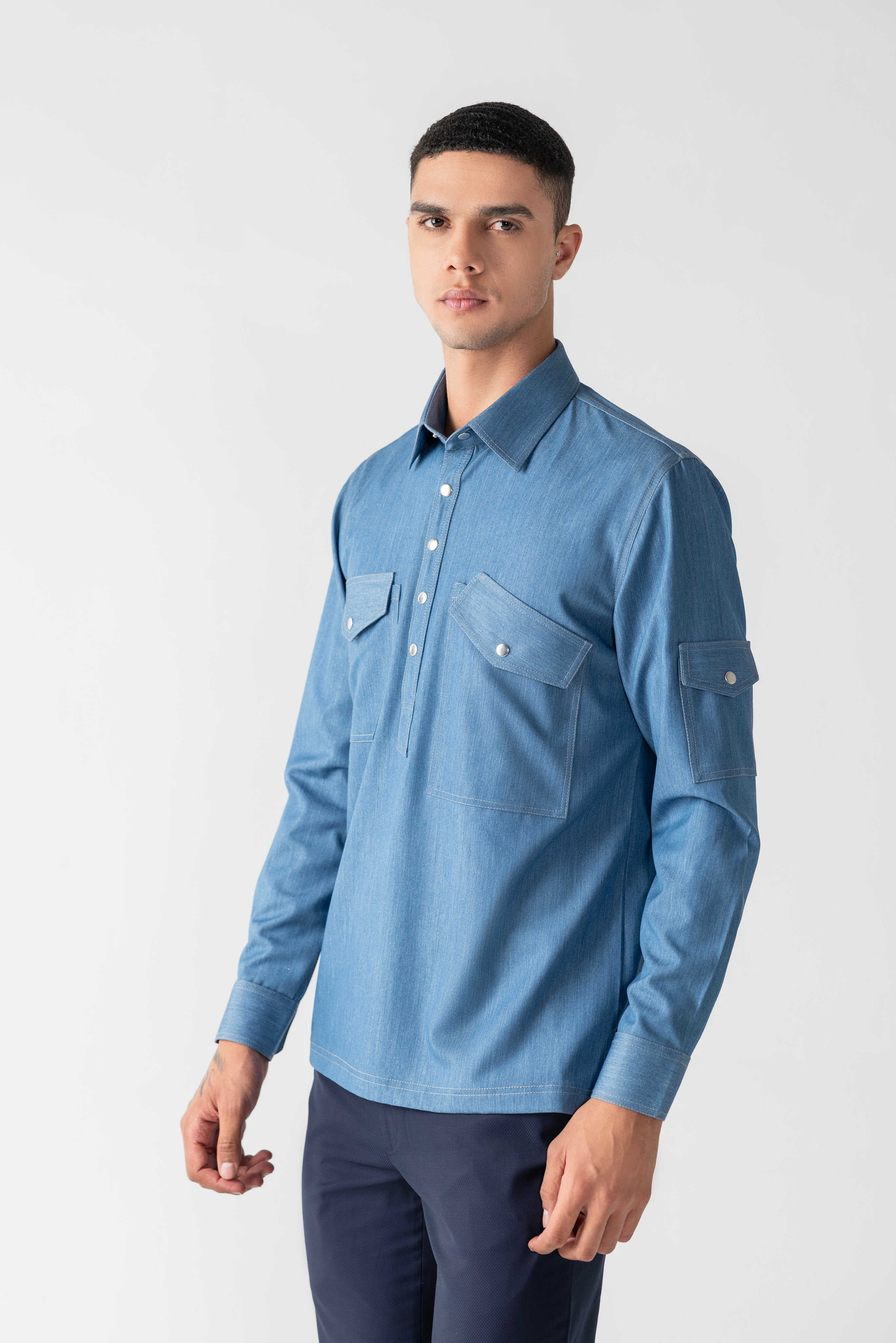 Light denim shirt with patch pocket detailing.