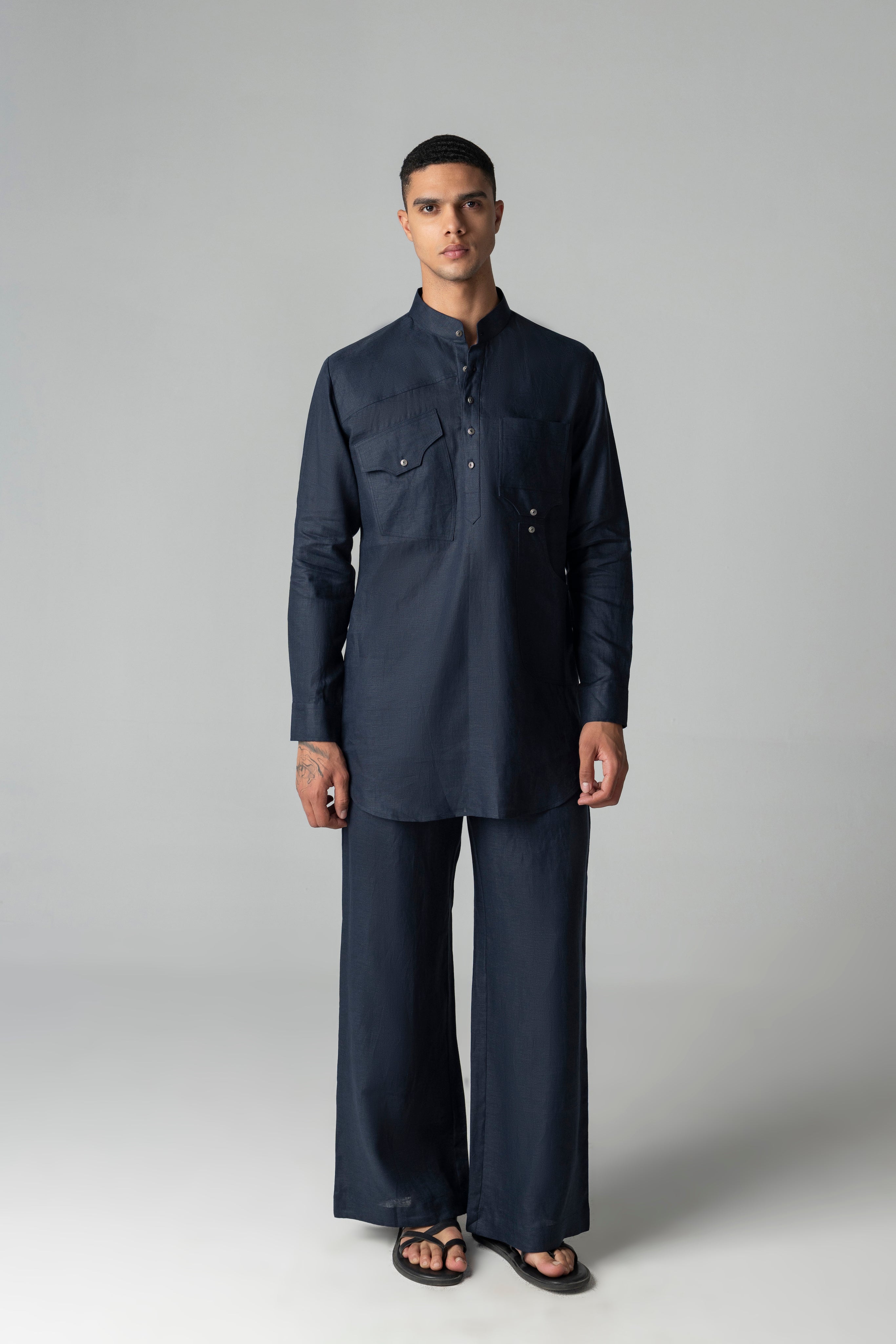 Navy blue linen short kurta with patch pocket detailing, paired with a matching plazzo