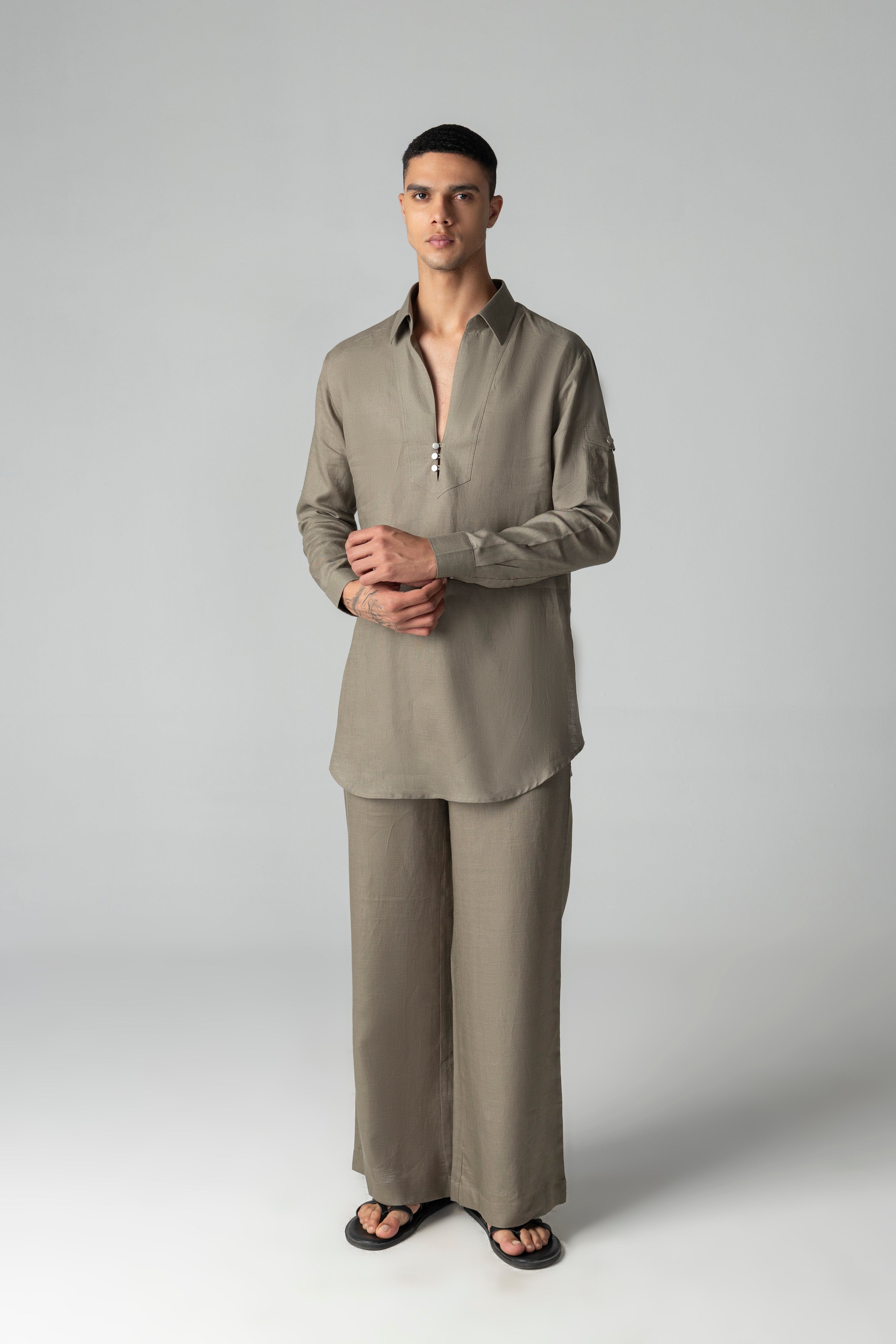 Olive green short linen kurta with button detailing, paired with a matching plazzo.