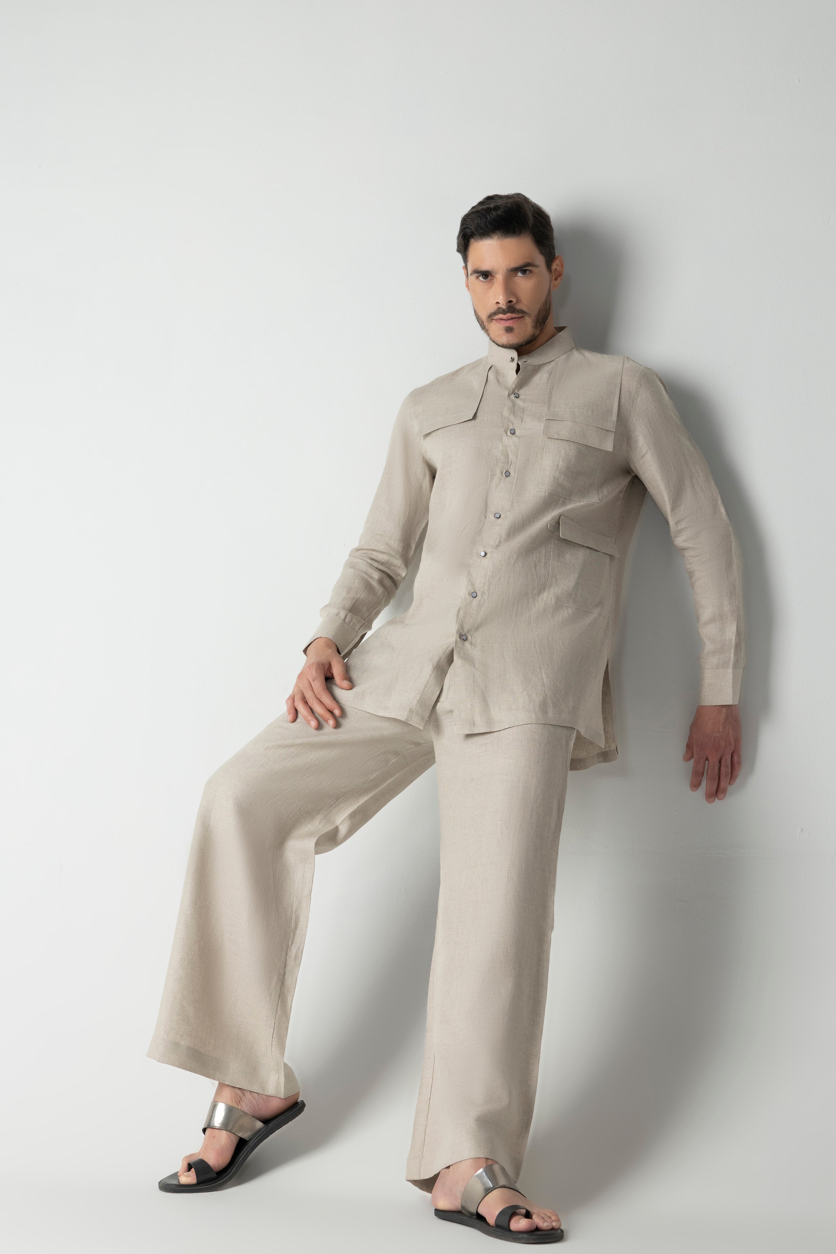 Beige linen short kurta with patch pocket detailing, paired with a matching plazzo