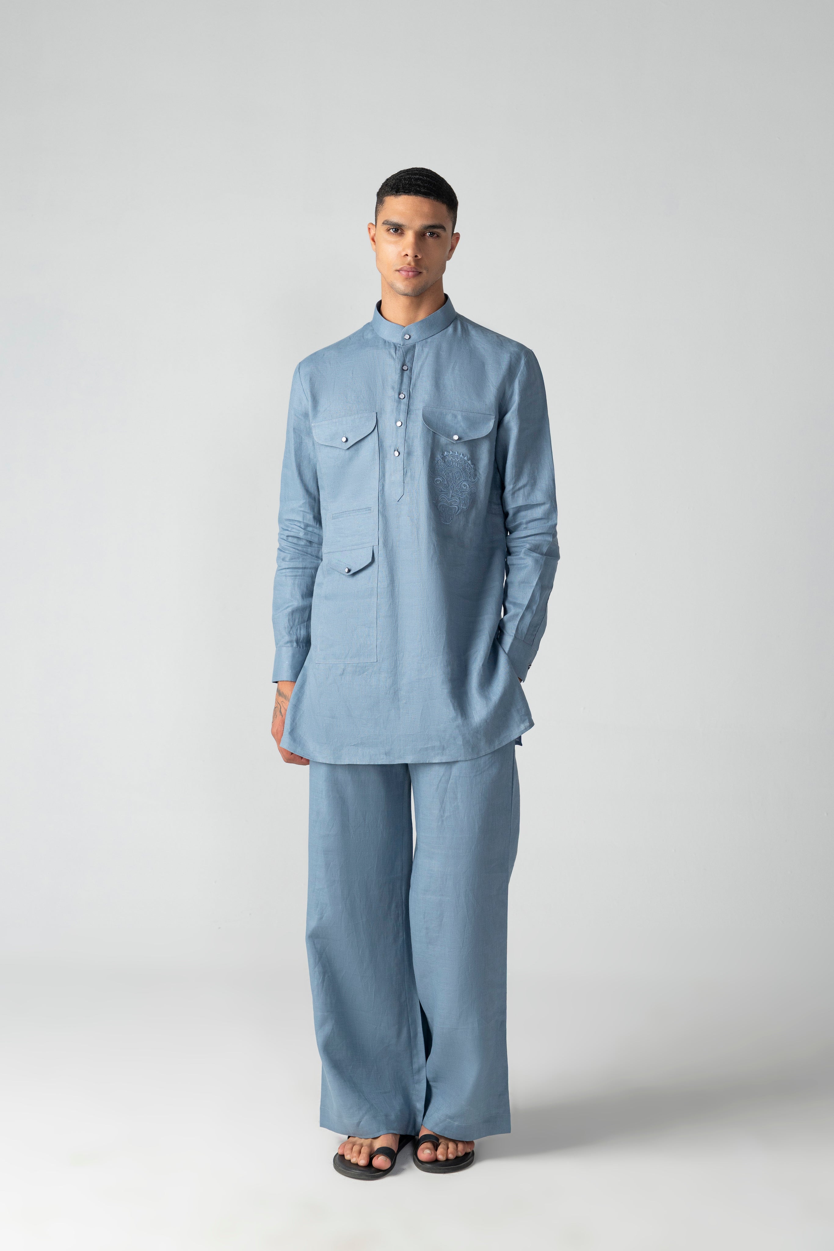 Navy blue linen short kurta with patch pocket & thread embroidery detailing, paired with a matching plazzo