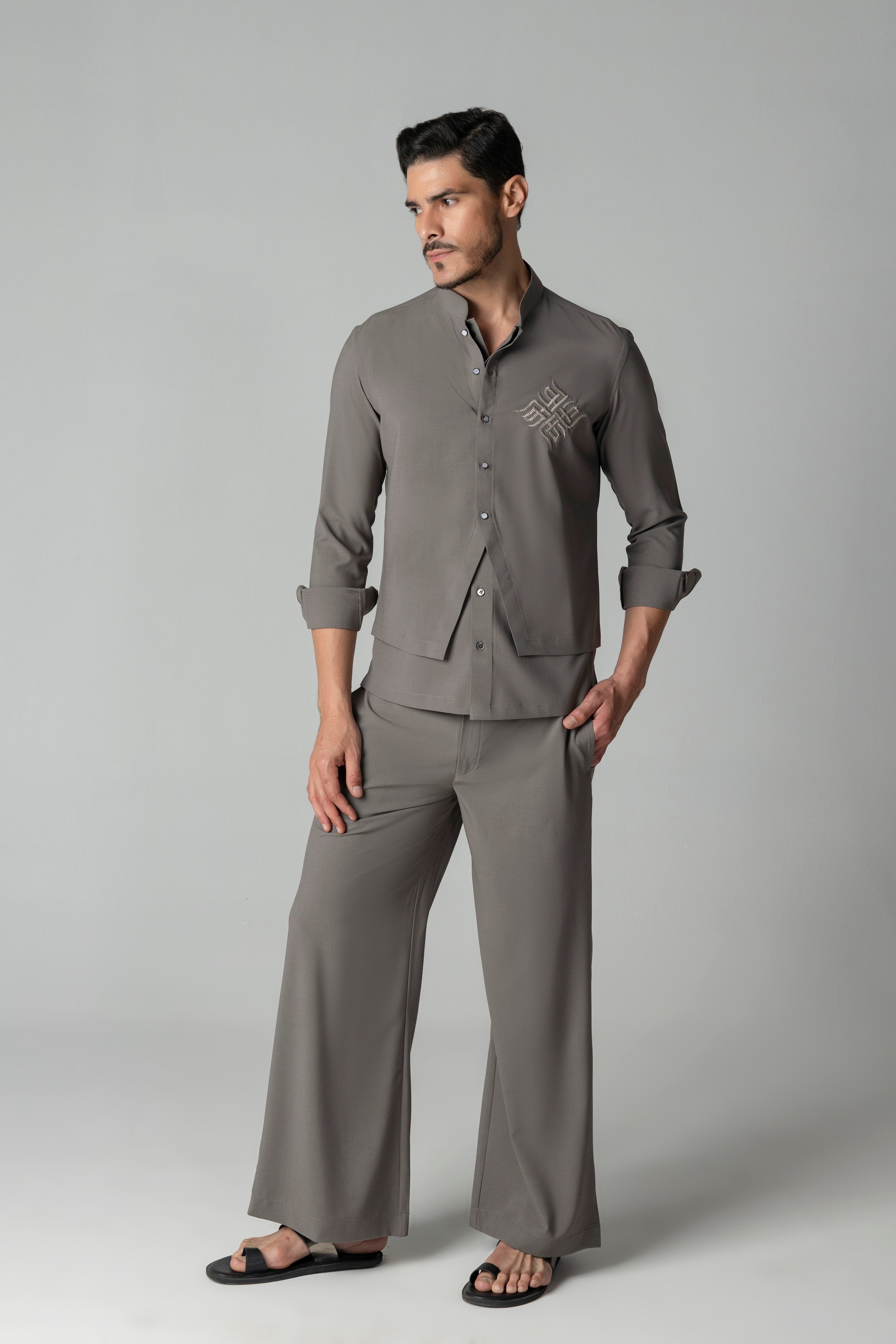 Mouse coloured shirt with asymmetrical cuts & thread embroidery detailing on the chest, paired with a matching plazzo