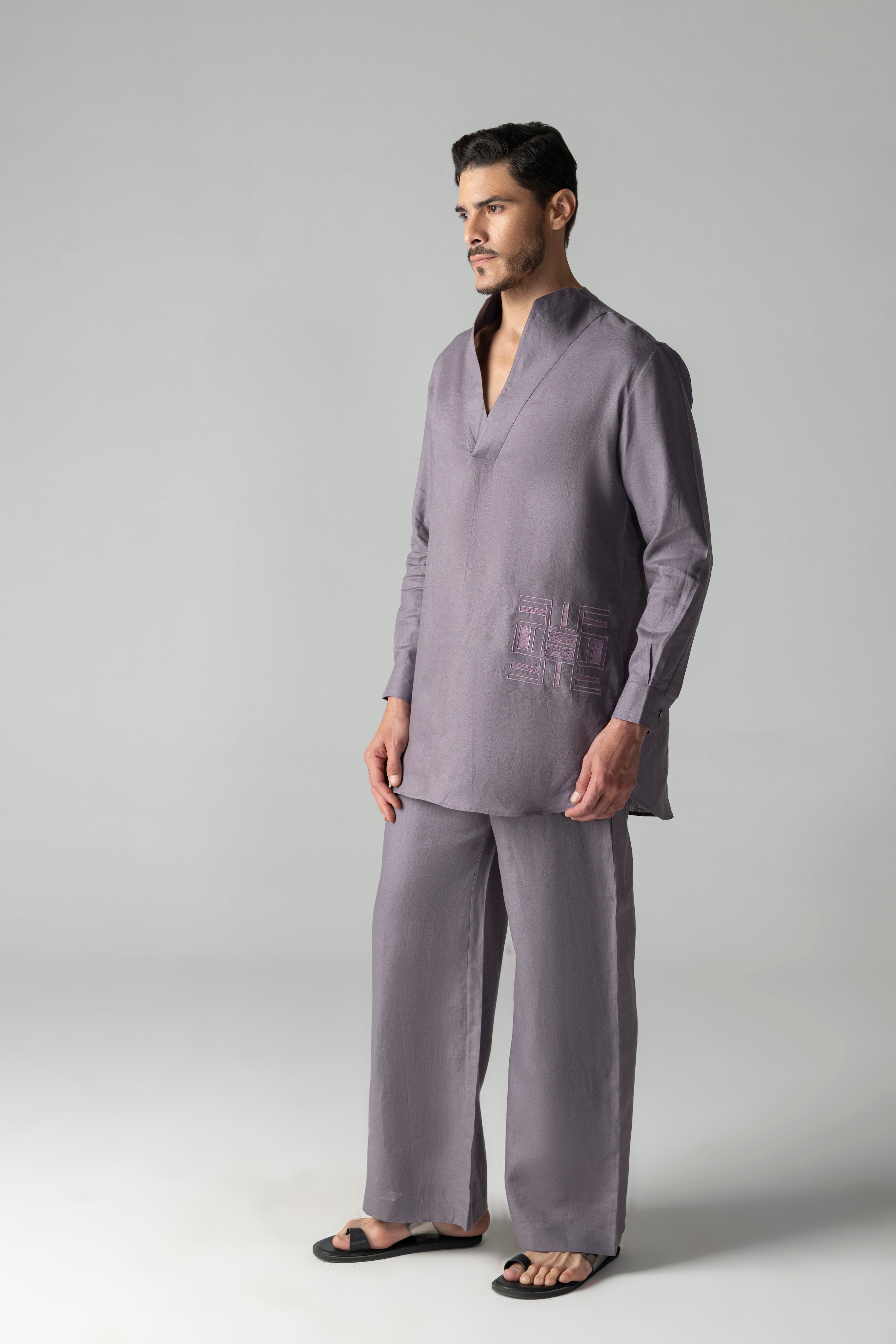 Mauve short linen kurta with thread embroidery detailing on the waist, paired with a matching plazzo