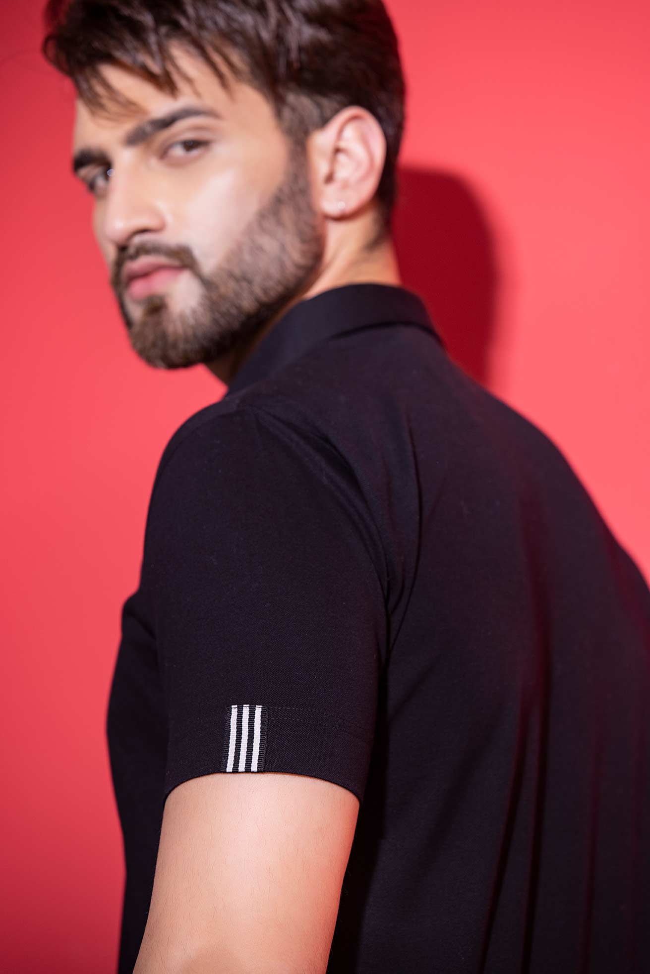 Black half-sleeved t-shirt with metal button & trims detailing